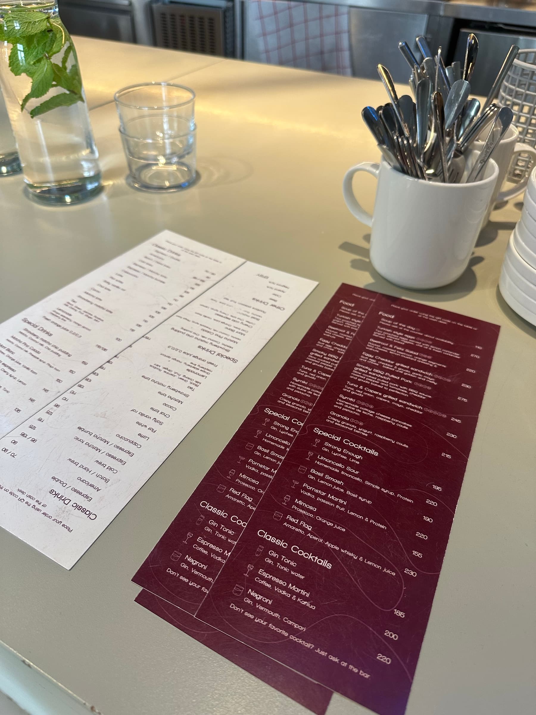 Cream and burgundy printed menus on the Efsy bar